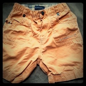 Orange Burberry shorts, used in good condition.